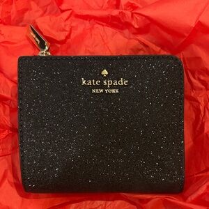 kate spade black glitter zip-around wallet with gold logo